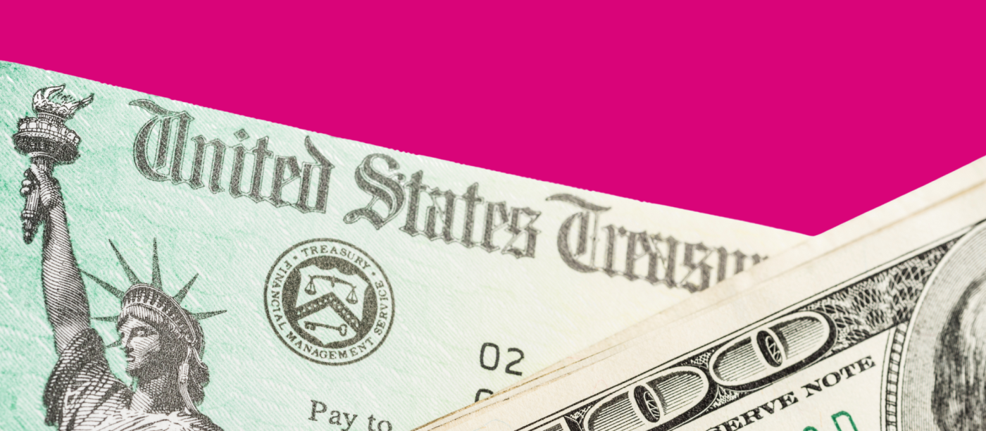 Partial view of a U.S. Treasury refund check next to a snippet of a one-hundred dollar bill.