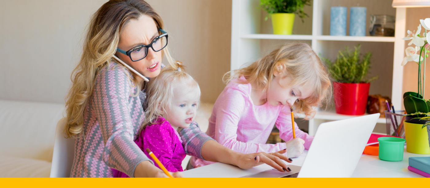 Busy mom working from home with two children.