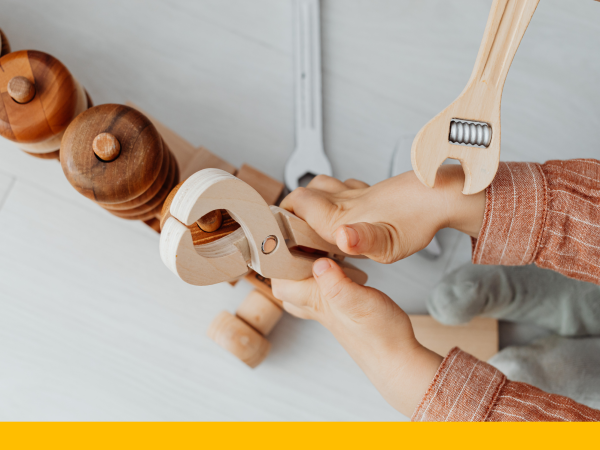 Child playing with a play tool set