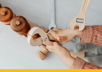 Child playing with a play tool set