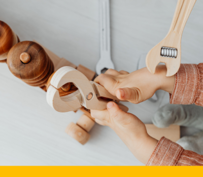 Child playing with a play tool set Child playing with a play tool set