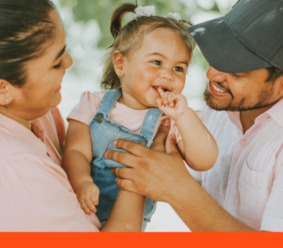 mother and father holding young daughter mother and father holding young daughter